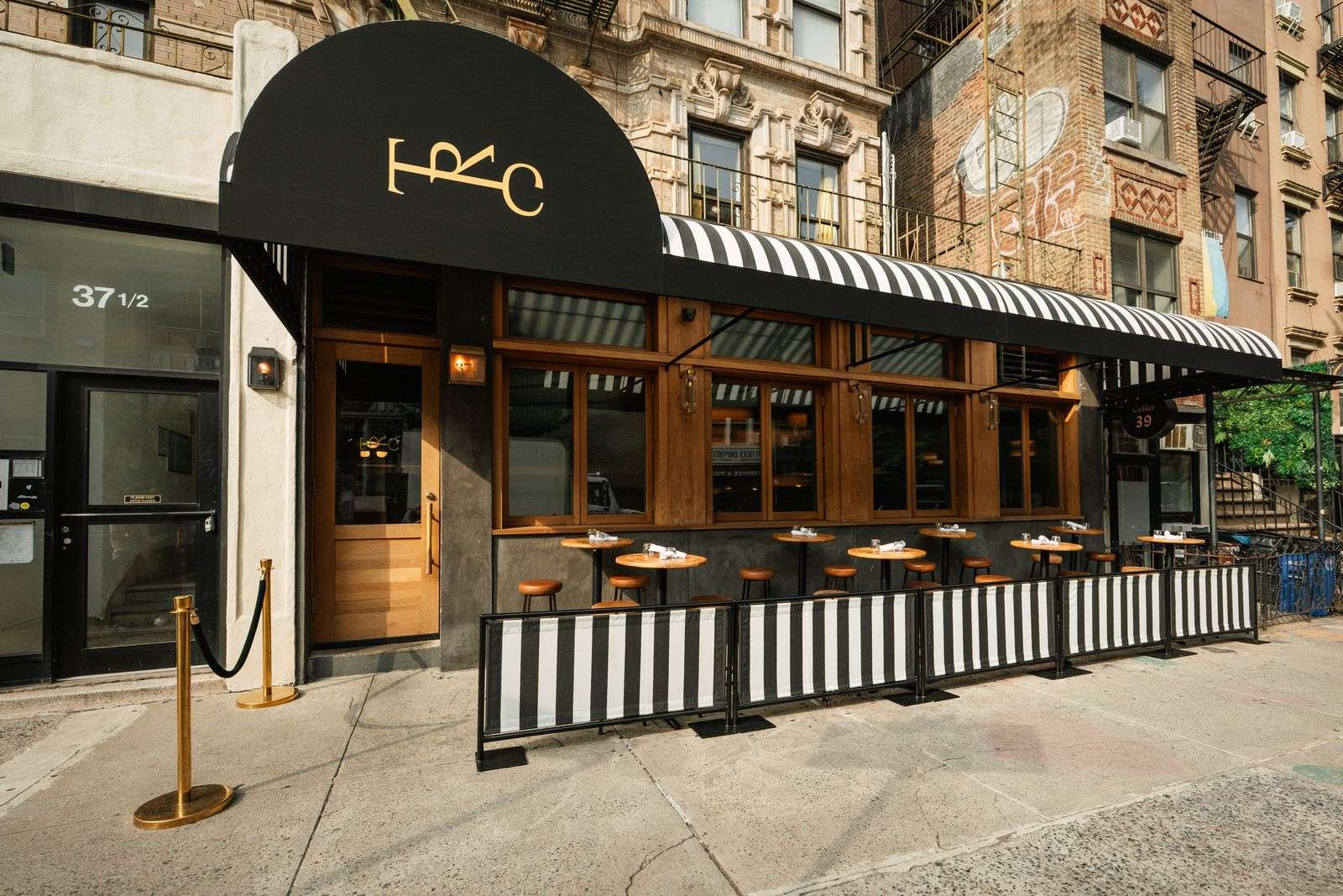 The Rhymers' Club storefront and striped awning at 37½ St Marks Place