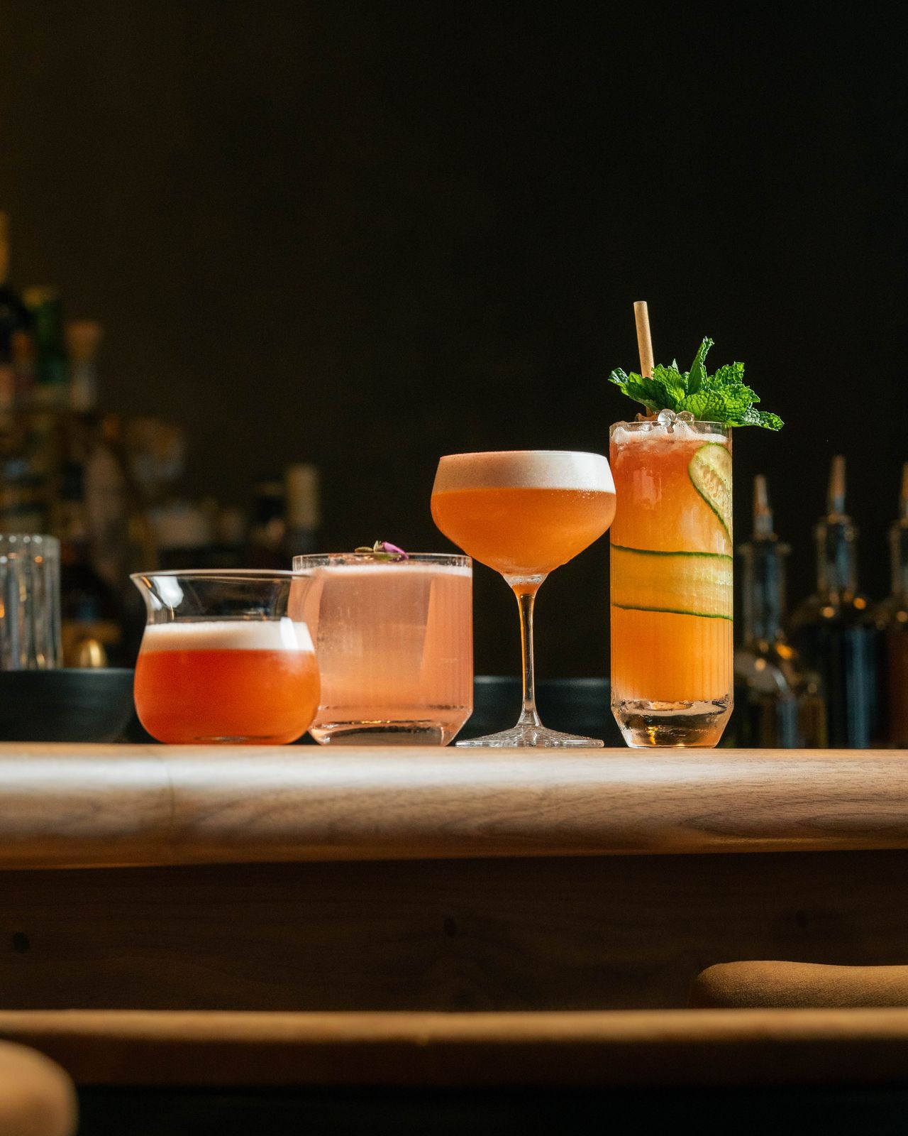 Four craft cocktails on the bar